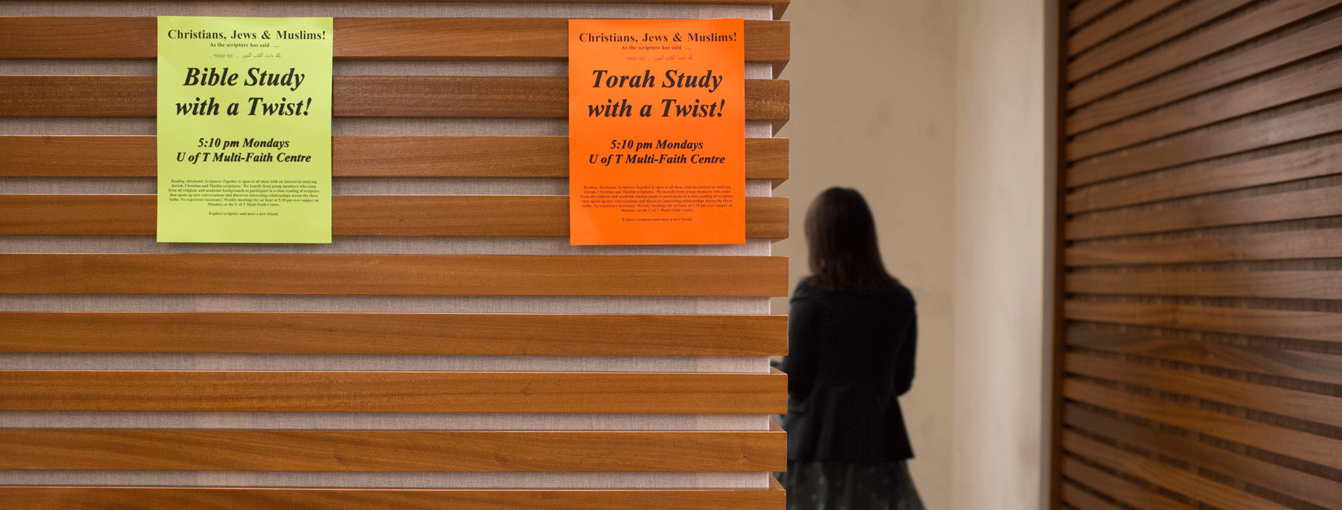 Interfaith posters on stylish wood plank wall
